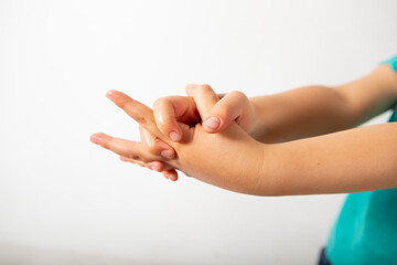 hands of a child desinfecting dirty hands. 