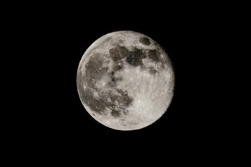 Obraz na płótnie Canvas Full moon in a black sky. Astronomy concept