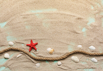 Fototapeta na wymiar Red starfish, seashells and sea rope on sand on turquoise wooden background. Place for text.