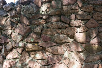 Old wall of rough masonry
