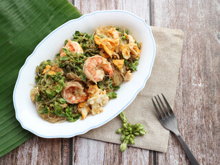 Stir fry glass noodle with shrimp and cowslip creeper ( Dok Kajon pad Woonsen) - Thai authentic food