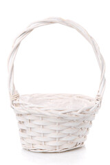 White wicker basket with high handle on a white background.