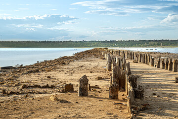 Wooden columns protrude from the kuyalnitsky estuary