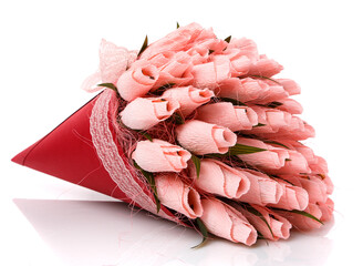 Pink tulips made of corrugated paper in a red wrap with lace on a white background. Inside the flowers are candy. Sweet bouquet.