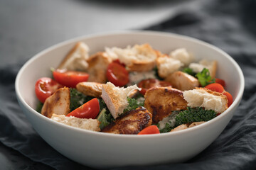 Caesar salad alternative with kale and turkey in white bowl