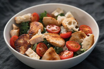 Caesar salad alternative with kale and turkey in white bowl