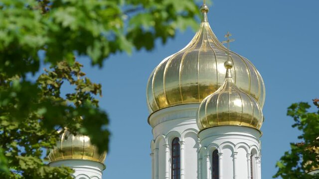Christian church Cathedral of St. Catherine golden domes against blue clear sky. Tsarskoe Selo, Pushkin town, Saint Petersburg, Russia.