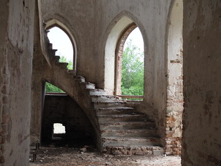Destroyed Lutheran church of 19th century against blue sky in former canton of Schaefer in Saratov region. Outdoor. Travel to historical places of Russia.