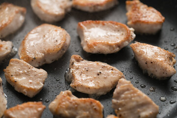 fying chicken fillet slices on nonstick pan