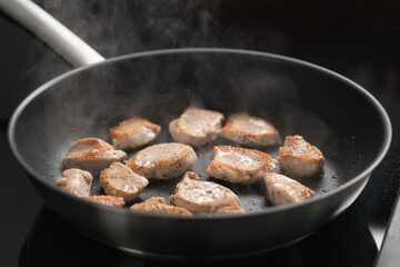 fying chicken fillet slices on nonstick pan