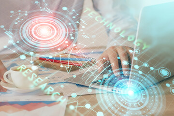 Double exposure of data internet theme hologram with man working on computer on background. Concept of innovation.