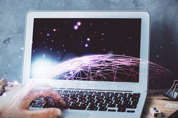 Media network theme hologram with man working on computer on background. Concept of internet...