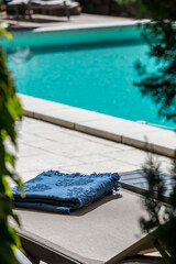 blue beach towel blanket on a deckchair in vacations