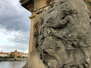 Amazing view of St. Wenceslas being murdered in front of the Vltava River with dark storm clouds