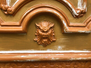 Painted door with a screaming devil head
