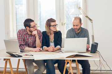 Freelance working from home - several people doing job remotely using laptop.
