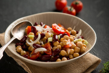chickpeas salad witn red beans tomatoe onions and thymus