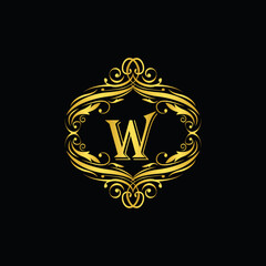 W letter  golden  flower  ornament. Vector logo. Monogram alphabet gold . Beautiful floral capital luxury