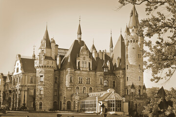 Obraz premium Mosna, Poland - October 12: 17th-century Moshni castle in an eclectic style. Sights of Poland. tinted image October 12, 2019 in Mosna, Poland