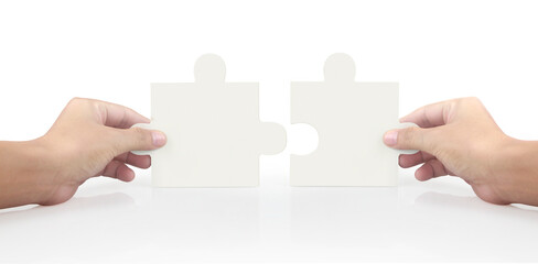 Hand of connecting jigsaw puzzle
