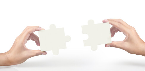 Hand of connecting jigsaw puzzle