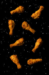 Fried chicken legs flying isolated