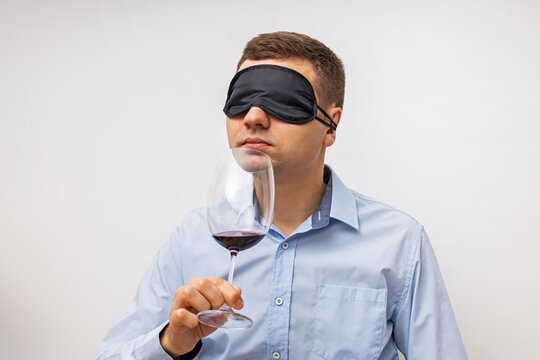 Silhouette of man degusting wine. Isolated on white
