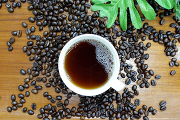 High view, black coffee in a white mug, put on a cloth on the table top