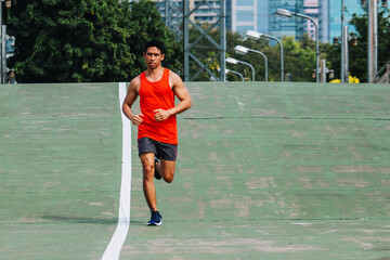 Obraz premium runner on the street be running for exercise on city road; sport, people, exercising and lifestyle concept