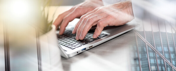 Fototapeta na wymiar Male hands working on laptop; multiple exposure