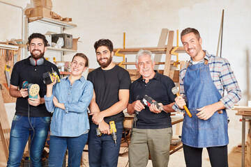 Group of carpenters with apprentices and masters