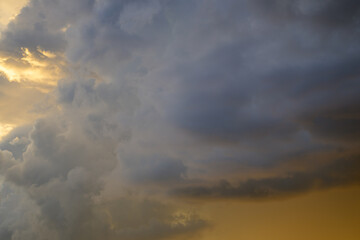 Fototapeta na wymiar Dramatic stormy cloudscape at sunset
