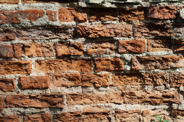 The brick wall of an old building
