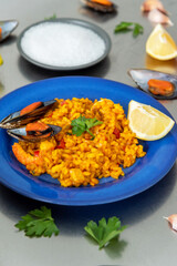 Spanish paella on plate on table