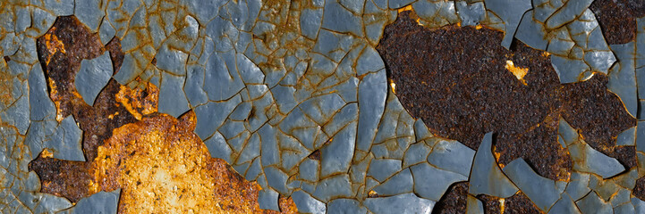 Texture of rusty metal with peeling enamel. Rough surface of painted metal with rust. Corroded and oxidized old iron. Rusted metal. Wide panoramic texture for background and design in grunge style.