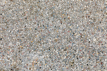 old concrete floor with small pieces of marble and natural stones