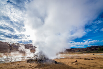 Fototapeta na wymiar Hverir geothermal area with boiling mudpools and steaming fumaroles in Iceland