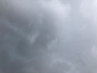 Beautiful dark rain storm clouds and white fluffy on sky,thunderstorm in dramatic sky,with lens flare.Climate cloudscape,selective focus.Weather tropical  summer squall.Time lapse footage.  © praditkhorn