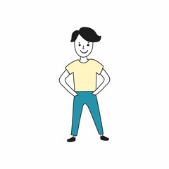 A man in a T-shirt and blue jeans stands and smiles, holds his hands in his pockets.