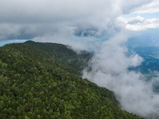 新緑の恵那山山頂上空よりガス立ち昇る中津川方面を空撮