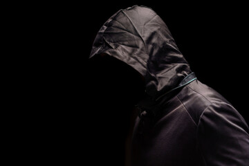 Portrait of Invisible man in the hood on black background. - obrazy, fototapety, plakaty