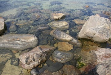 A close view of some Lewisian gneiss rocks in the sea on the Isle of Lewis, Scotland.