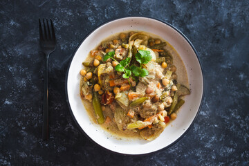 plant-based food, vegan chickpeas stew with carrots onion and broccoli in creamy dairy-free sauce