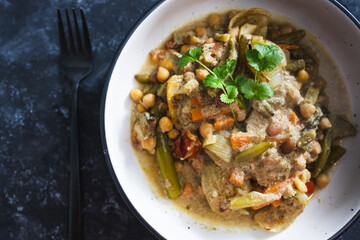 plant-based food, vegan chickpeas stew with carrots onion and broccoli in creamy dairy-free sauce