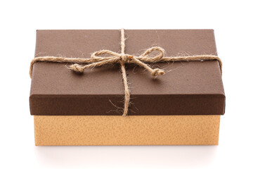 Brown gift box with linen ribbon on a white background. Gift for her husband. Gift for any holiday.