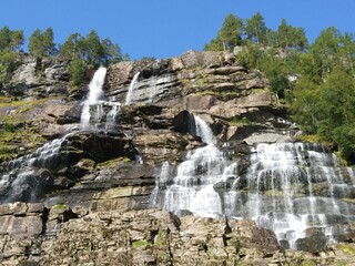 Beautiful Norwegian mountains, waterfalls and cliffs in the Hardangerfjord, Norway. 