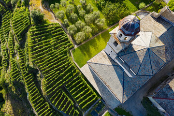 Valtellina (IT) - vineyards and terraces in the Poggiridenti area - church of the Madonna del...