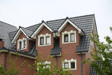 Part of a brick modern building build in classic style