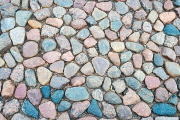 cobblestone pavement made of round stone around the ancient Peter and Paul Fortress in St. Petersburg, Russia
