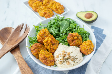 Healthy vegetarian buddha bowl with baked sweet potato, falafel
